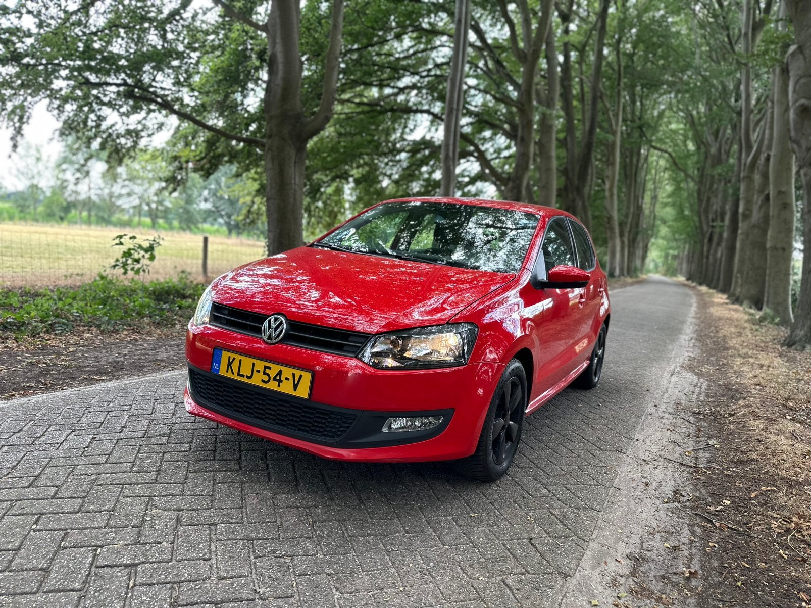 Volkswagen Polo 1.4 16V FSI 63KW 2012 Rood, Voorwielaandrijving, 970 kg, 4 cilinders, Handgeschakeld