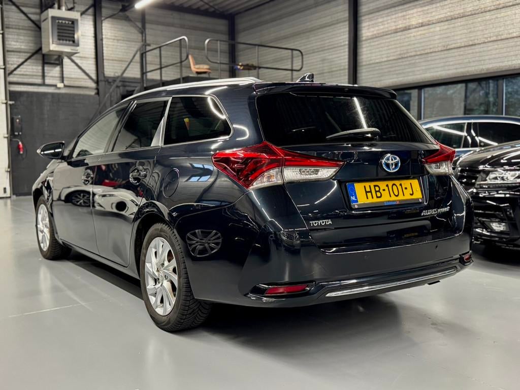 Toyota Auris Touring Sports 1.8 Hybrid Lease Pro, Gebruikt, Euro 6, Leder en Stof, Origineel Nederlands