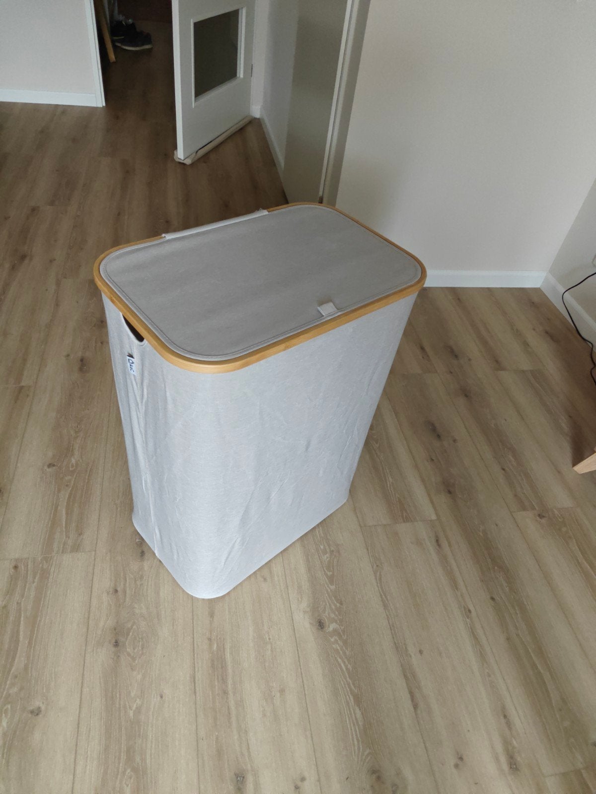 Wasmand met 3 zakken, Ophalen