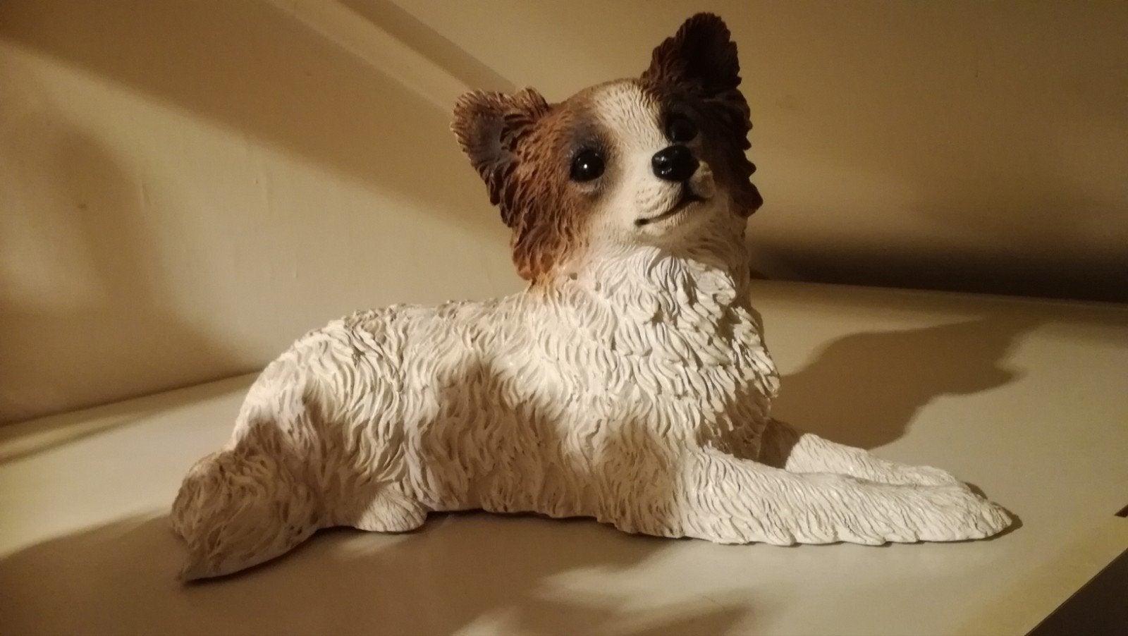 beeld hond vlinderhondje, Ophalen