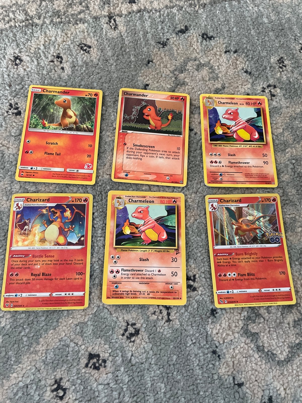 6 Pokémon kaarten: Charmander, Charmeleon, Charizard evoluti, Ophalen of Verzenden, Zo goed als nieuw, Meerdere kaarten