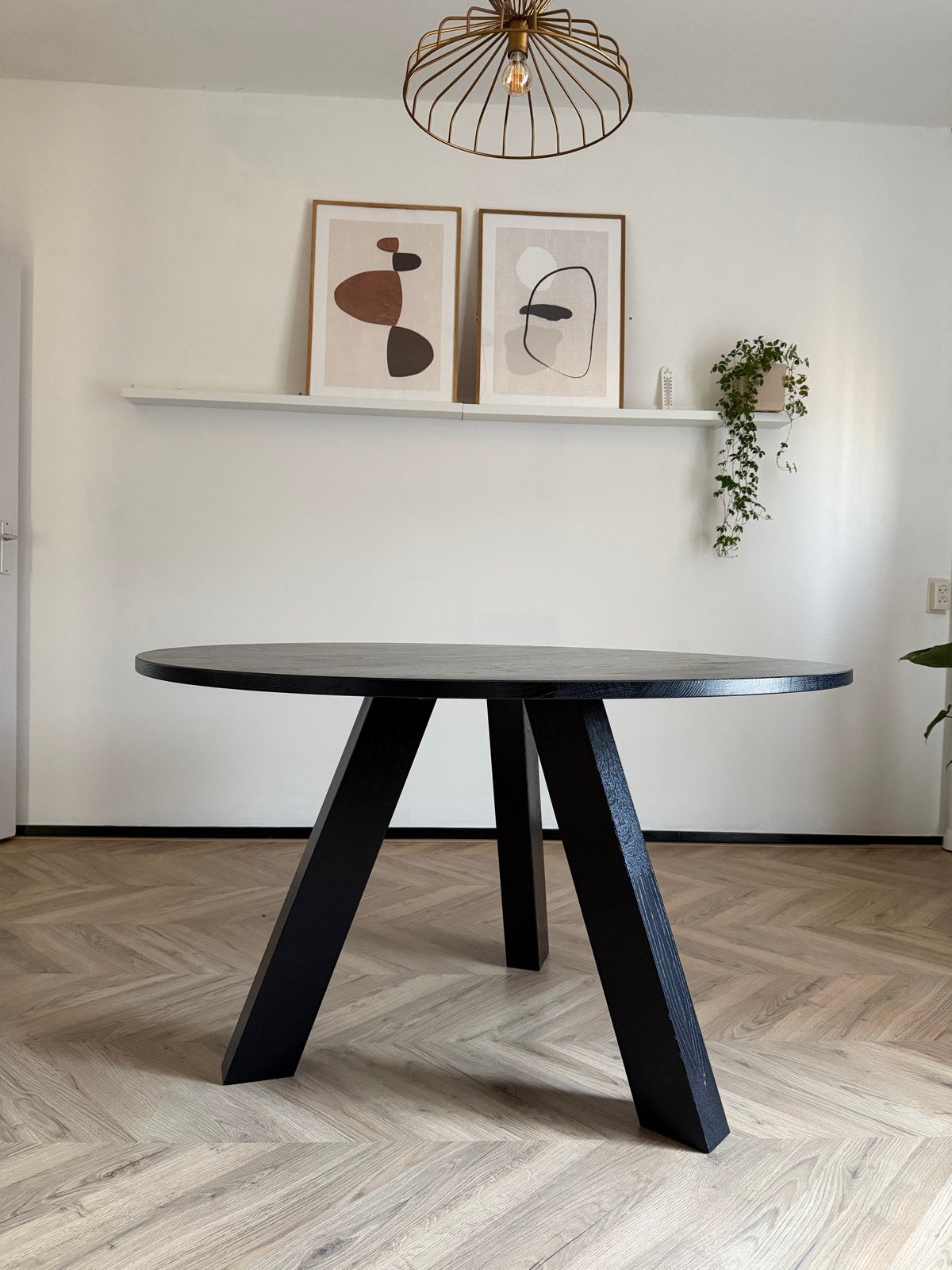 Ronde zwarte eettafel, Ophalen, 100 tot 150 cm, Rond, Zo goed als nieuw