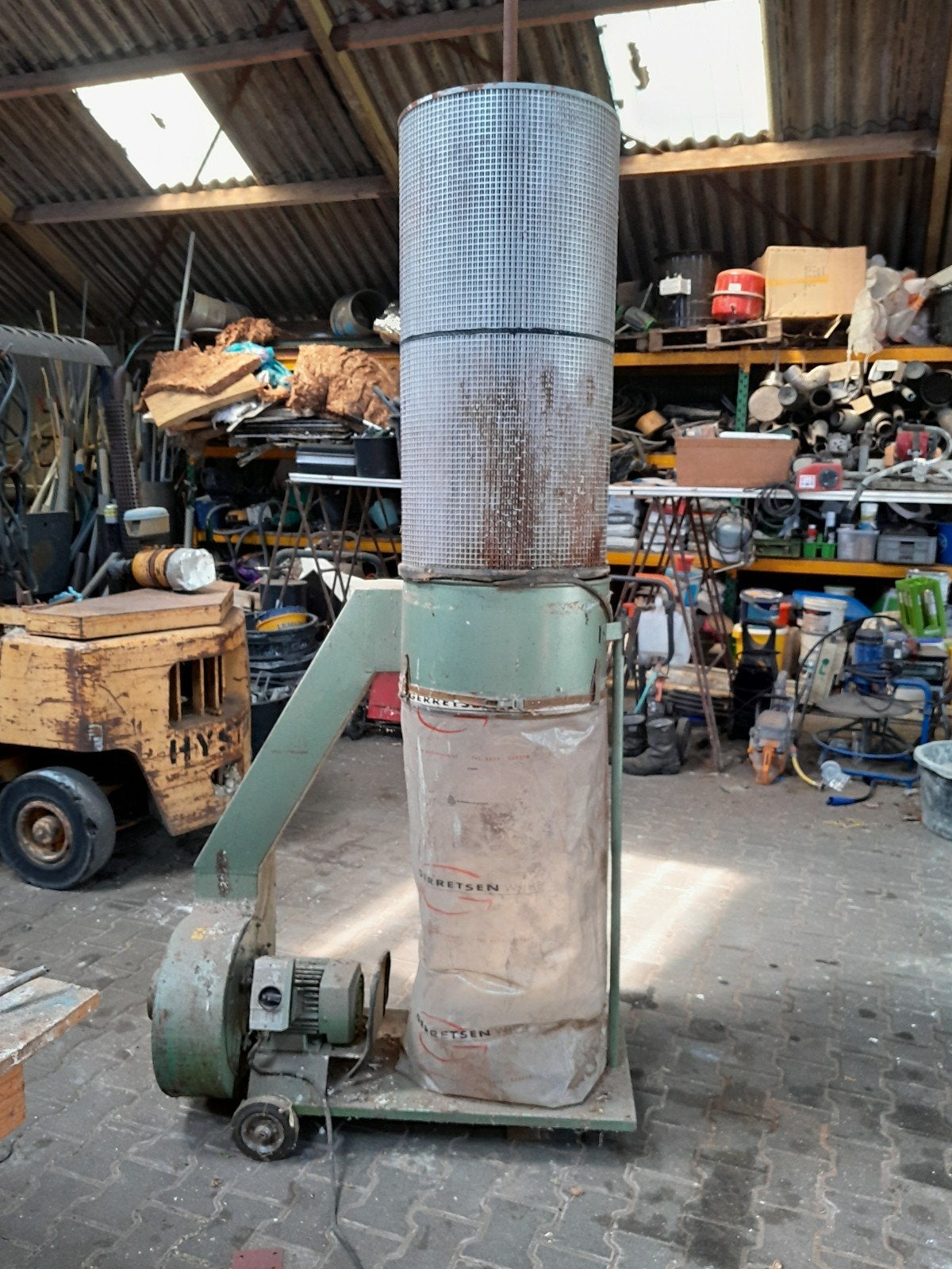 Stofafzuiger met ventilator en filterzak, Ophalen
