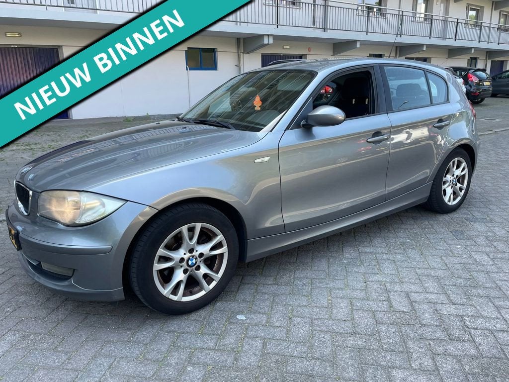 BMW 1-serie 116i Business Line, Auto's, BMW, 1-Serie, Zwart, 4 cilinders, 4 stoelen