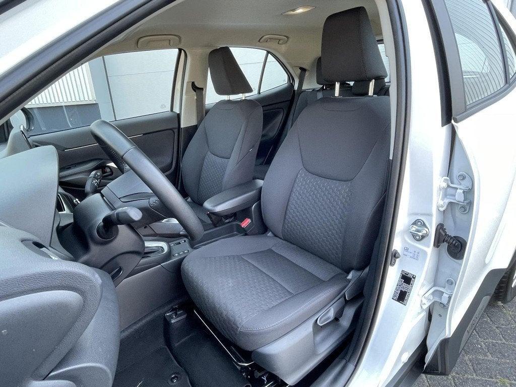 Toyota Yaris Cross 1.5 Hybrid 115 Active | Stoel- , stuur- e, Auto's, Toyota, Stof, Gebruikt, Start-stop-systeem, 1165 kg