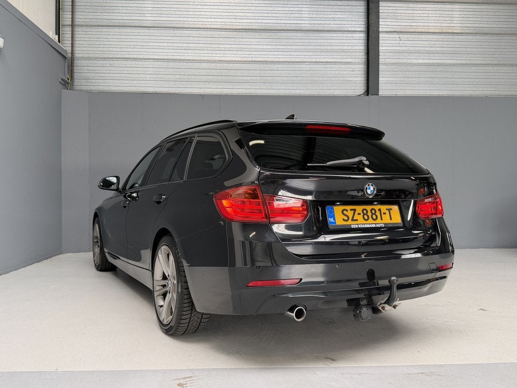 BMW 3 Serie Touring 320d High Executive Trekhaak|Cruise|Navi, Auto's, 21 km/l, Zwart, 4 cilinders, Zwart