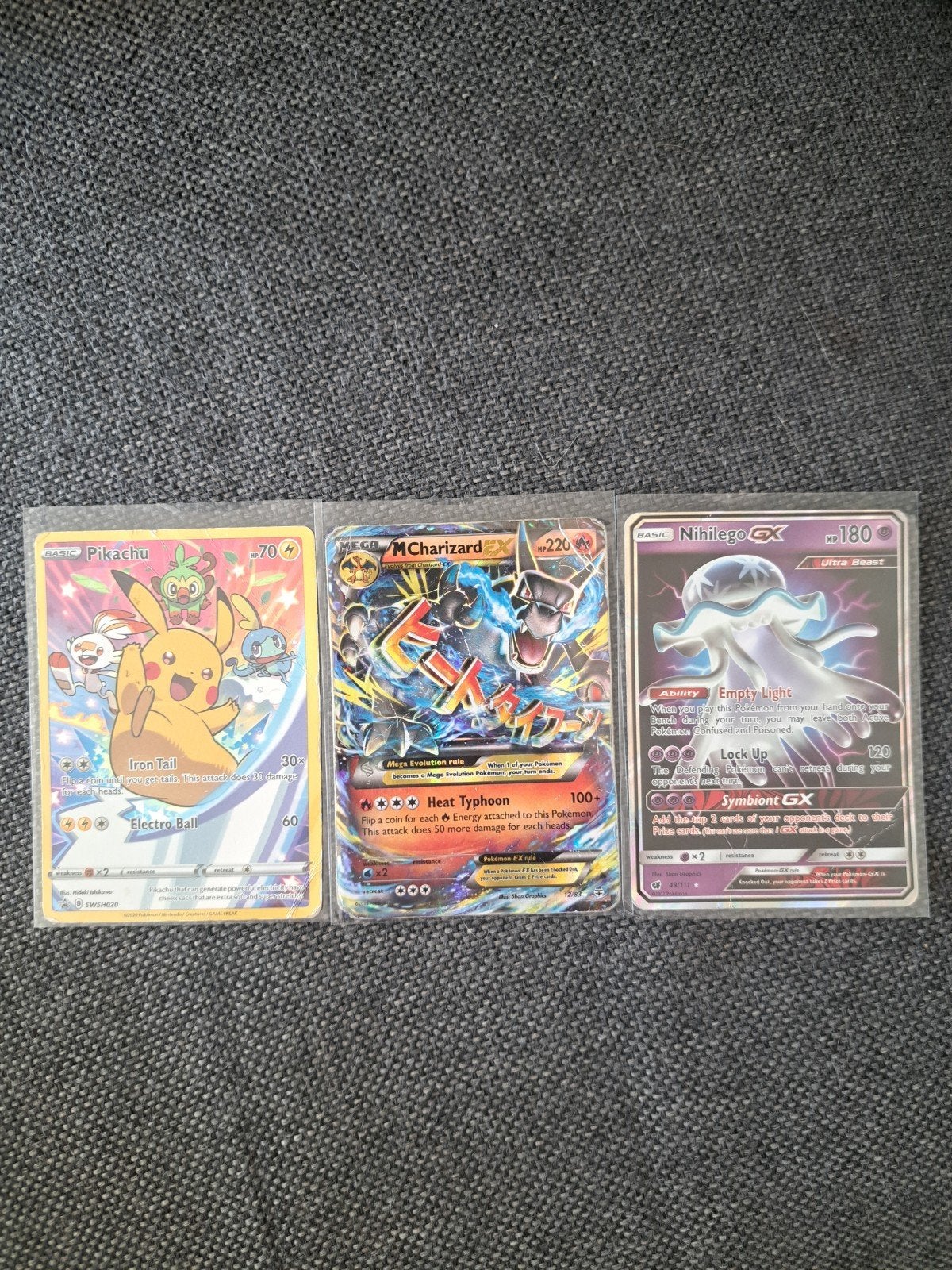 3 Pokémon kaarten - Pikachu, M Charizard EX, Nihilego GX, Ophalen of Verzenden, Gebruikt, Meerdere kaarten