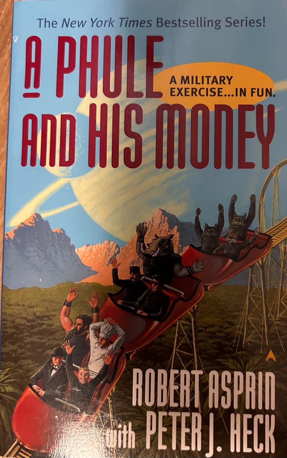 A Phule and His Money - Rober Asprin, Ophalen of Verzenden, Gelezen