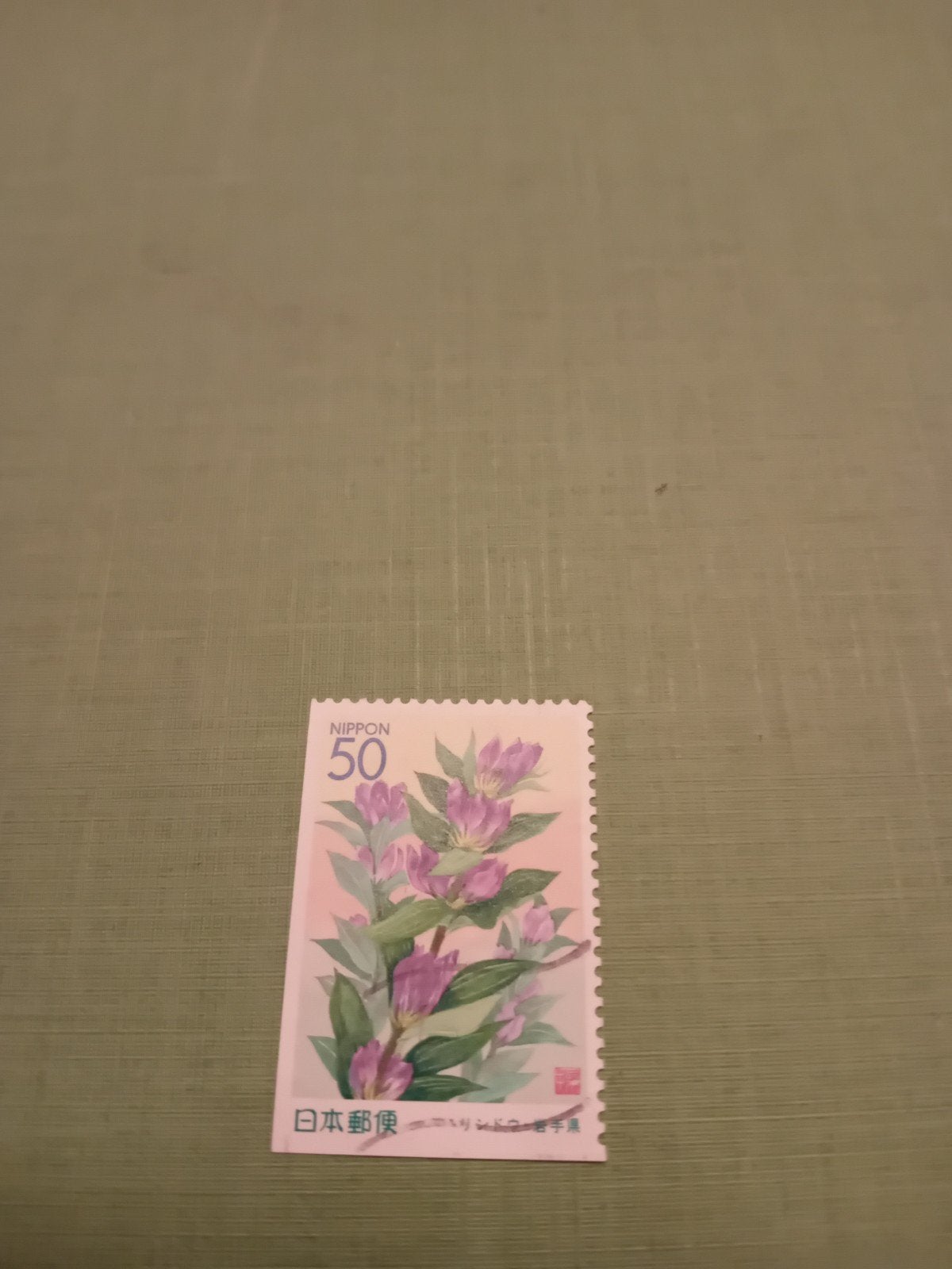 Japanse postzegel NIPPON 50 met bloemenmotief, Ophalen of Verzenden, Gestempeld