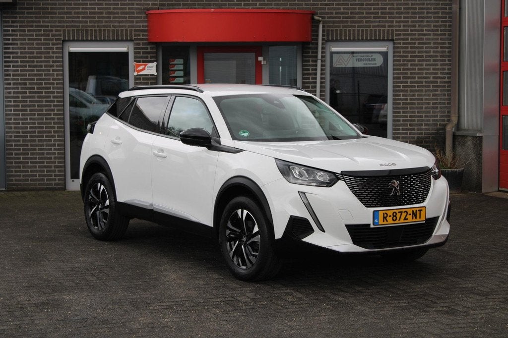 Peugeot 2008 1.2 PureTech Allure Incl Garantie en Aflevering, Gebruikt, Euro 6, 1199 cc, Leder en Stof