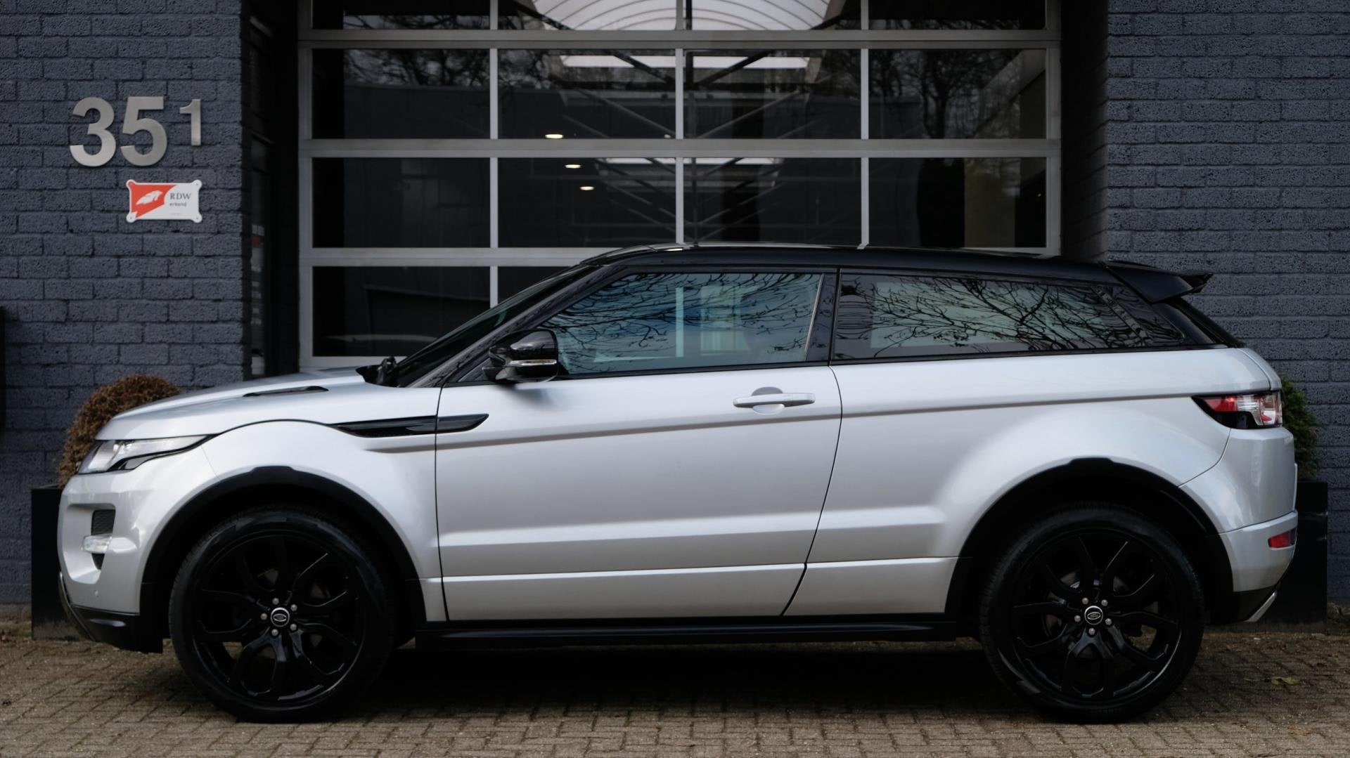 Land Rover Range Rover Evoque Coupé 2.0 Si 4WD Prestige Dyn, Auto's, Land Rover, Automaat, Zwart, 4 cilinders, 4 stoelen