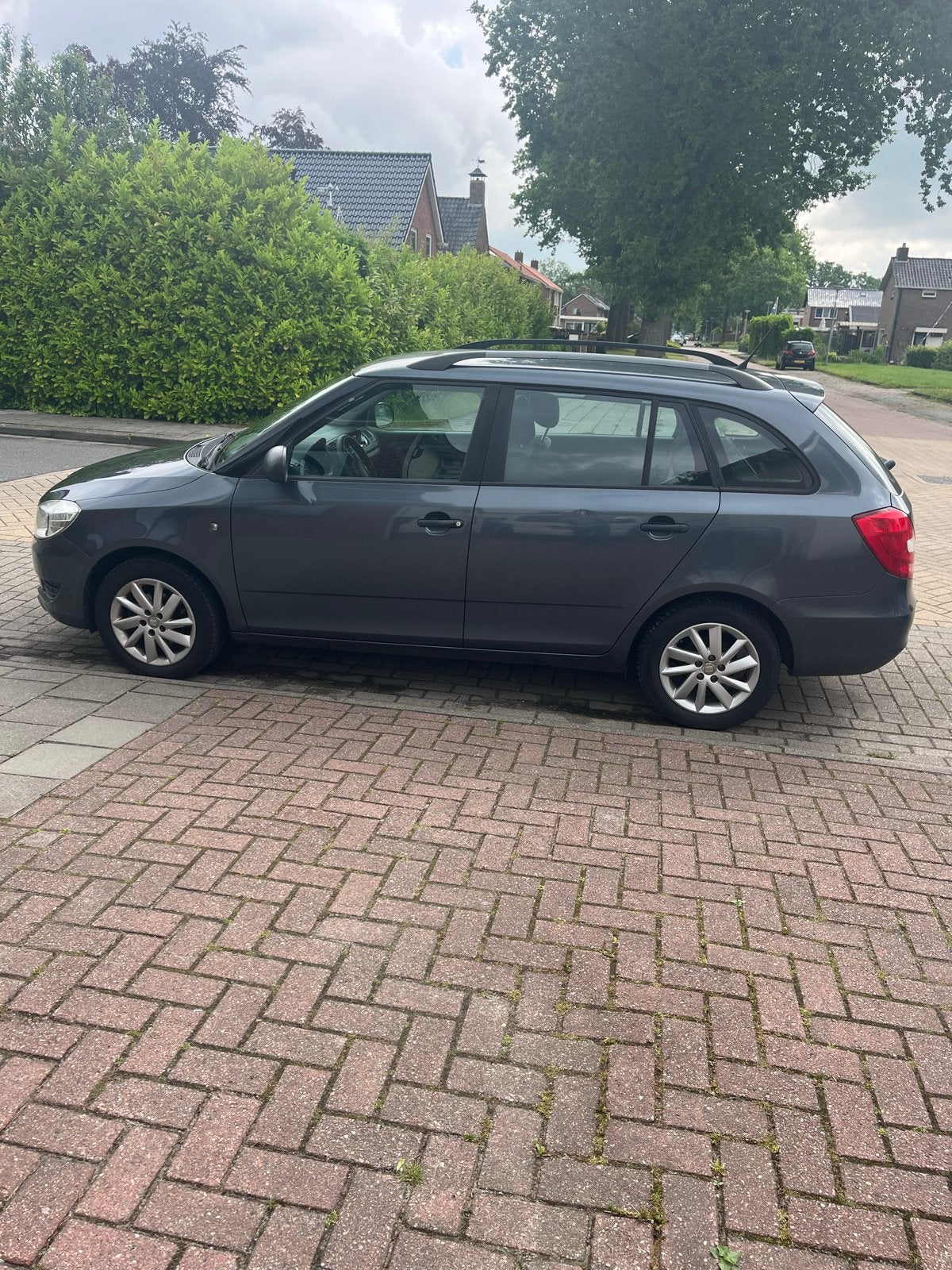 Skoda Fabia 1.2 51KW Combi 2012 Grijs, Voorwielaandrijving, 40 €/maand, 1198 cc, Origineel Nederlands