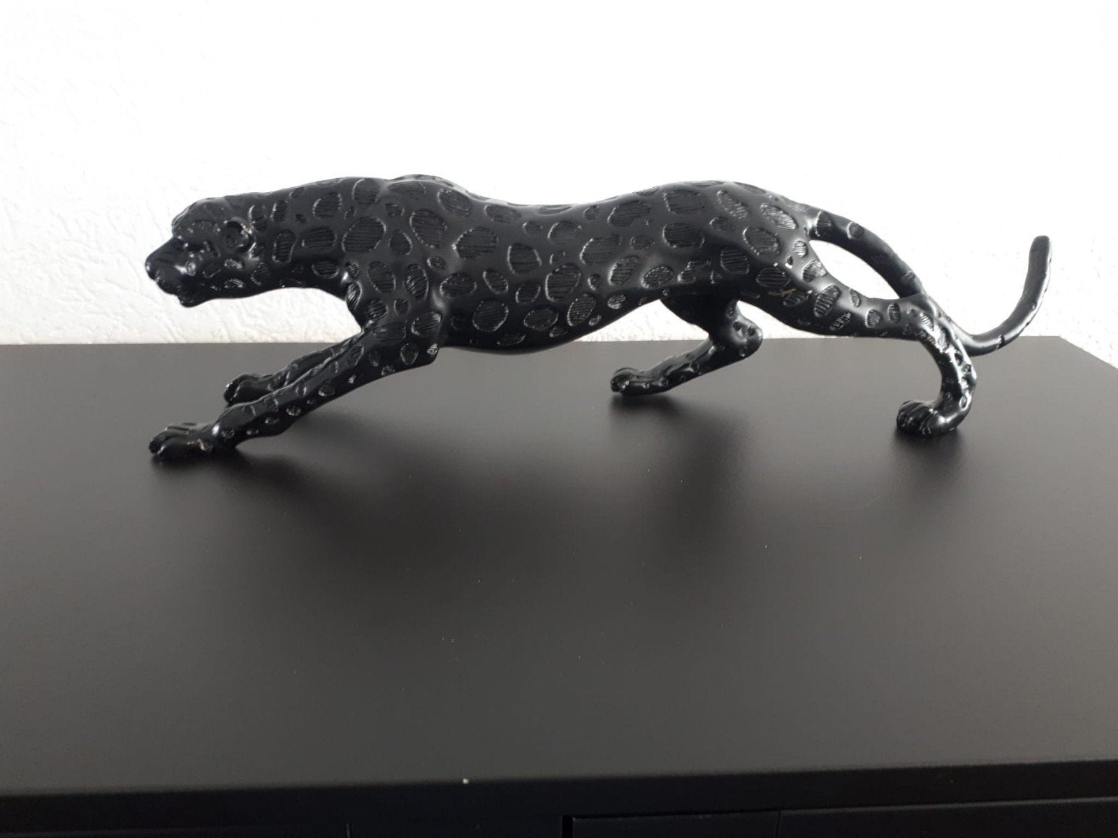 zwart panter beeld, Ophalen