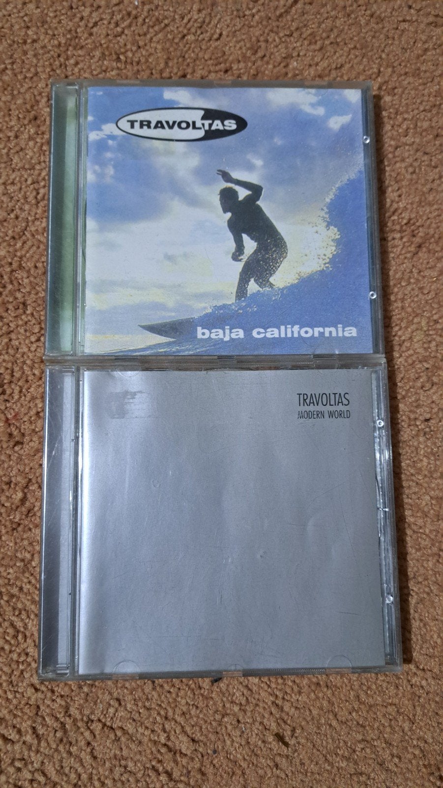 Travoltas - Baja California & Modern World, Inclusief boekje, Rock, Gebruikt, Ophalen of Verzenden