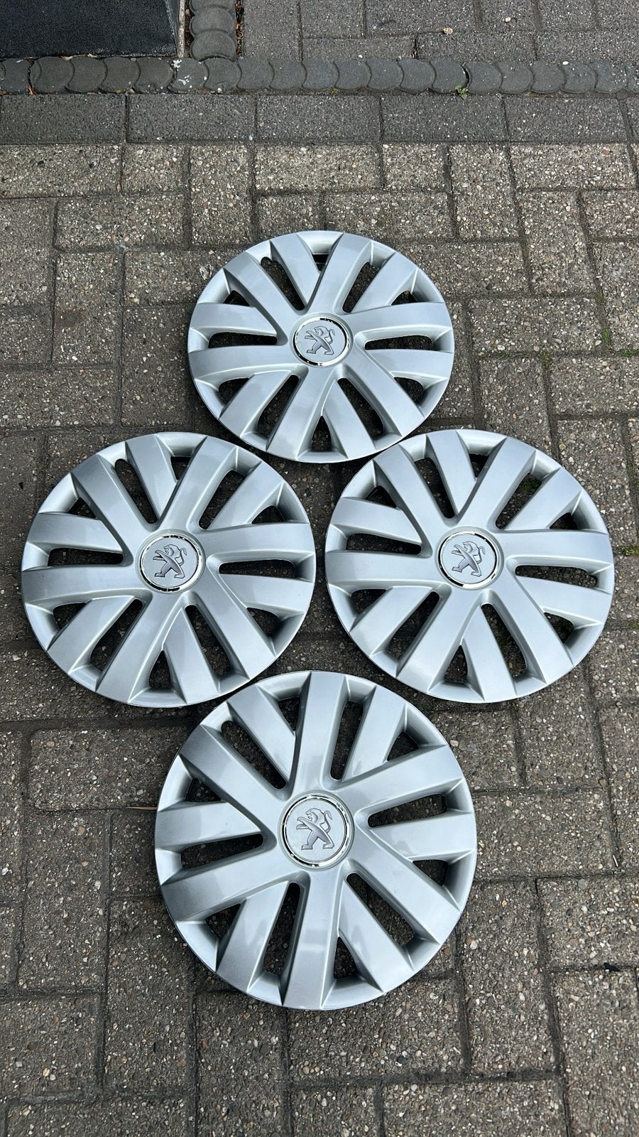 Set peugeot wieldoppen 15 inch, Ophalen of Verzenden, Nieuw