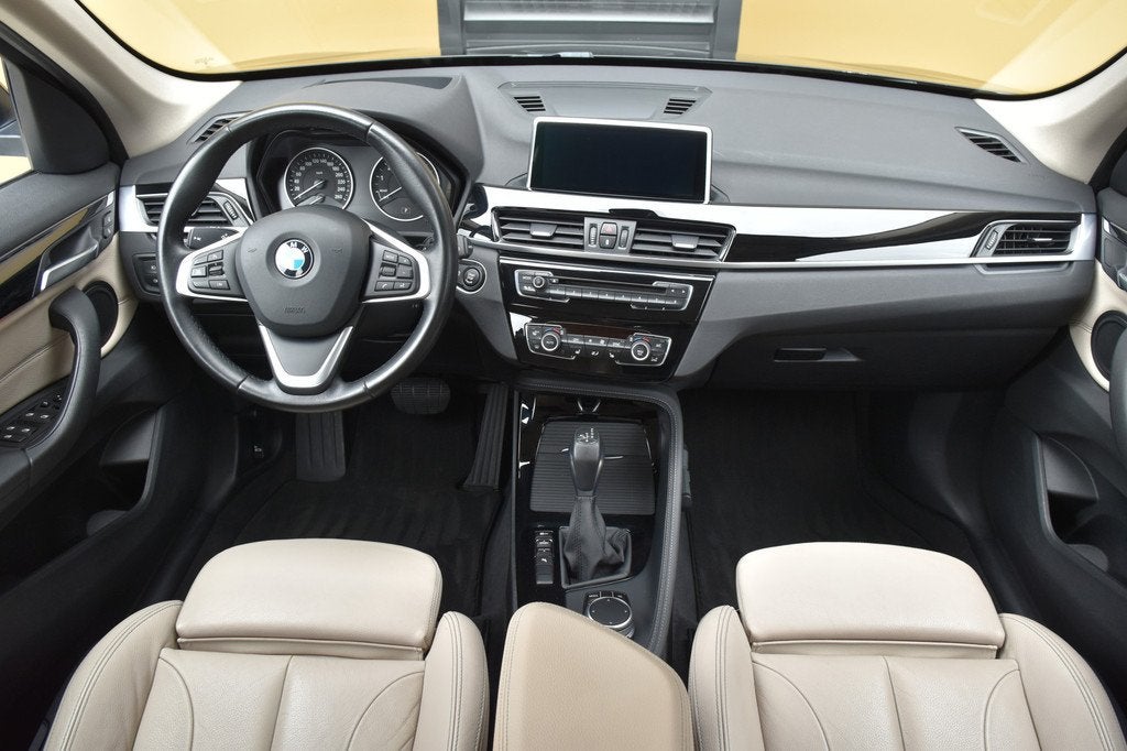 BMW X1 sDrive20i Centennial High Executive * Head-up * Sport, 1998 cc, Met garantie (alle), Zwart, SUV of Terreinwagen