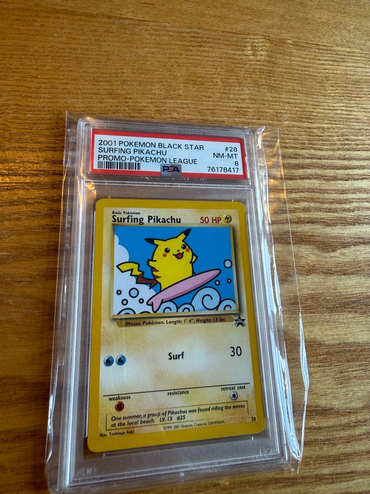 2001 Pokémon Black Star Promo - Surfing Pikachu #28 PSA 8, Ophalen of Verzenden, Zo goed als nieuw, Losse kaart