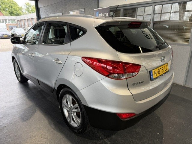 Hyundai Ix35 2.0i 4WD Active Aut.|Leder|Airco|NW APK, Auto's, Automaat, Gebruikt, Zwart, 4 cilinders