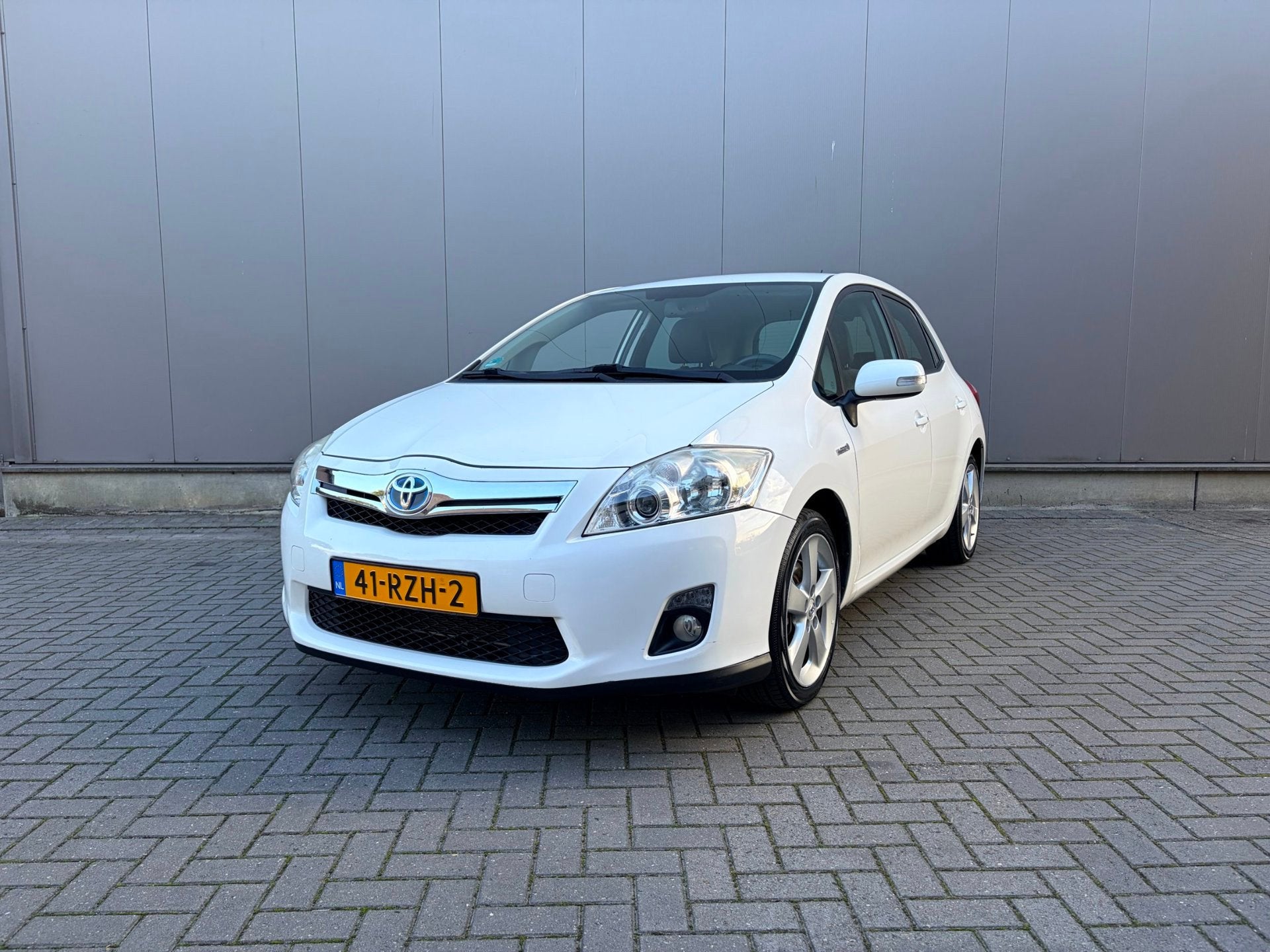 Toyota Auris 1.8 Full Hybrid Executive, Auto's, Gebruikt, Zwart, 4 cilinders, Leder en Stof