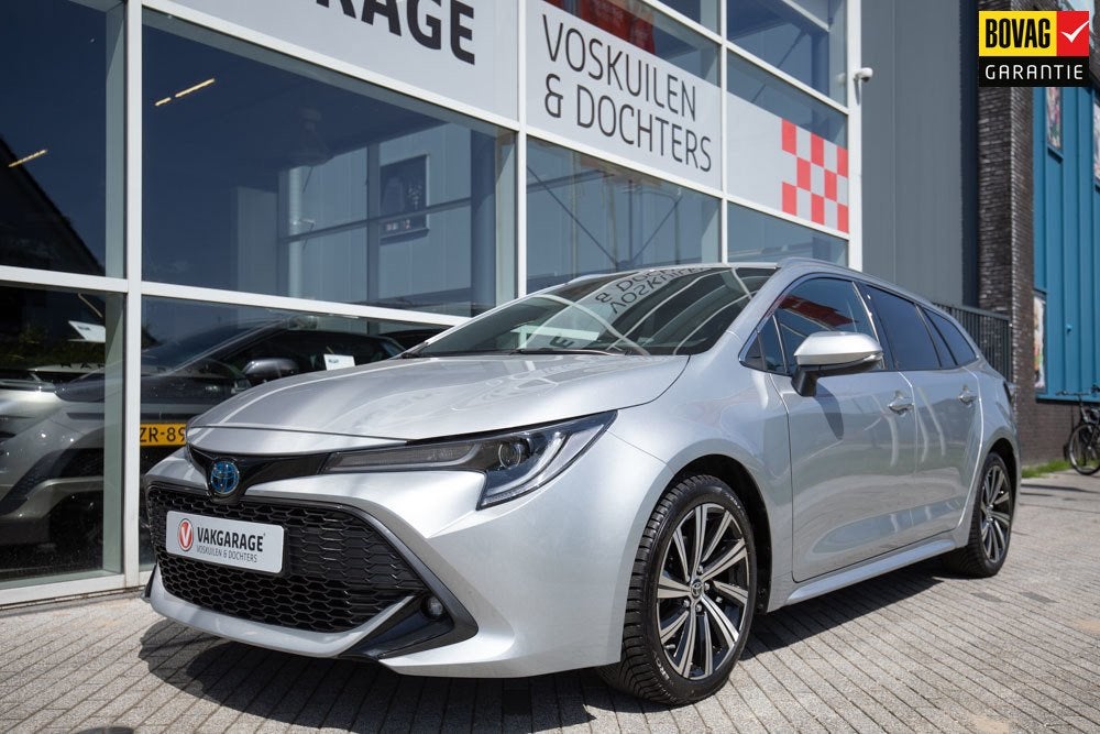 Toyota Corolla Touring Sports 1.8 Hybrid Dynamic Style, Gebruikt, 750 kg, 4 cilinders, Automatische klimaatregeling