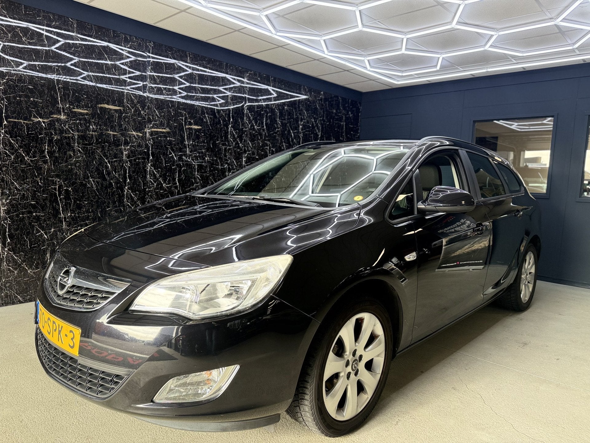 Opel Astra Sports Tourer 1.4 Turbo Edition (bj 2011), Auto's, Voorwielaandrijving, Euro 5, Stof, Gebruikt