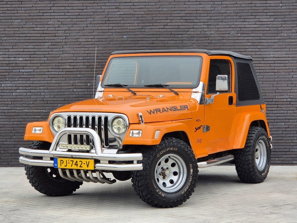 Jeep Wranger 4.0 Sport 4x4 177Pk, Softtop, Oranje, Auto's, Jeep, 450 kg, Overige kleuren, 4 stoelen, Leder