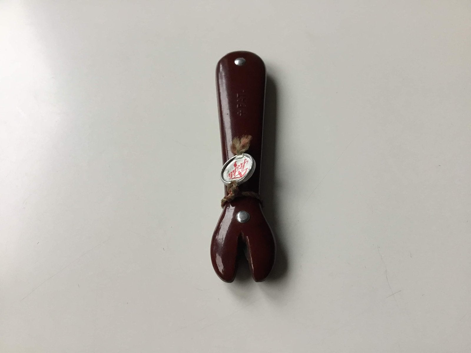 Bakeliet messen slijper 6.5 cm lang met Lootje €13,50, Ophalen
