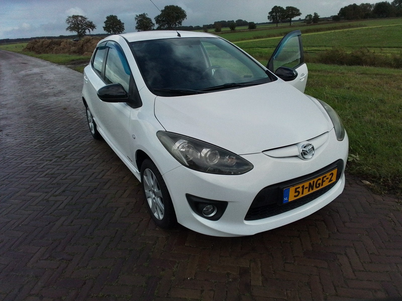 Mazda 2 1.3 63KW hp  5DRS 2010 Wit, Voorwielaandrijving, 31 €/maand, 4 cilinders, Wit