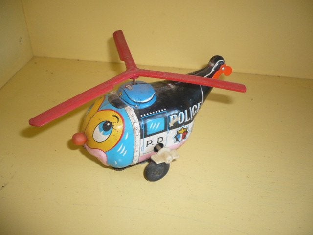Mie18><blikken opwindbare police helikopter made in japan, Verzenden