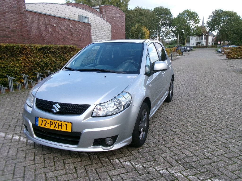 SUZUKI SX4 1.6 ARROW AIRCO-LM VELGEN-ZILVER GRIJS-NWE APK., Voorwielaandrijving, Dealer onderhouden, Stof, Bluetooth