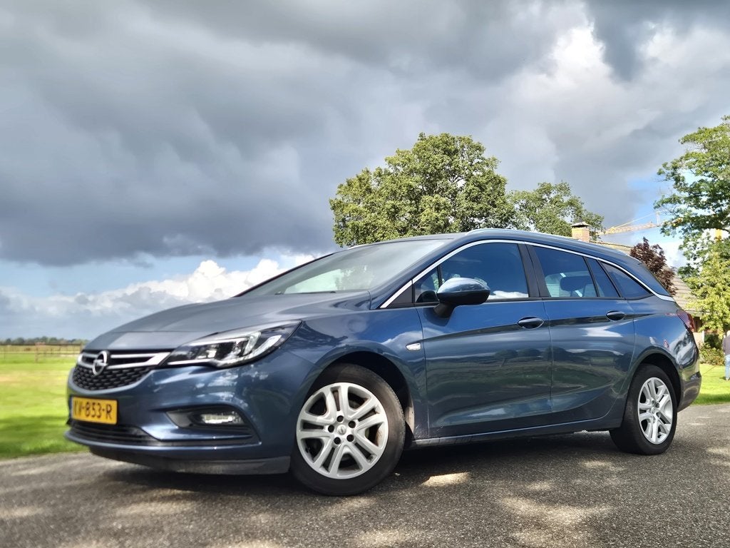 Opel Astra Sports Tourer 1.6 CDTI Business+ (bj 2016), Auto's, Gebruikt, Euro 6, 4 cilinders, Blauw