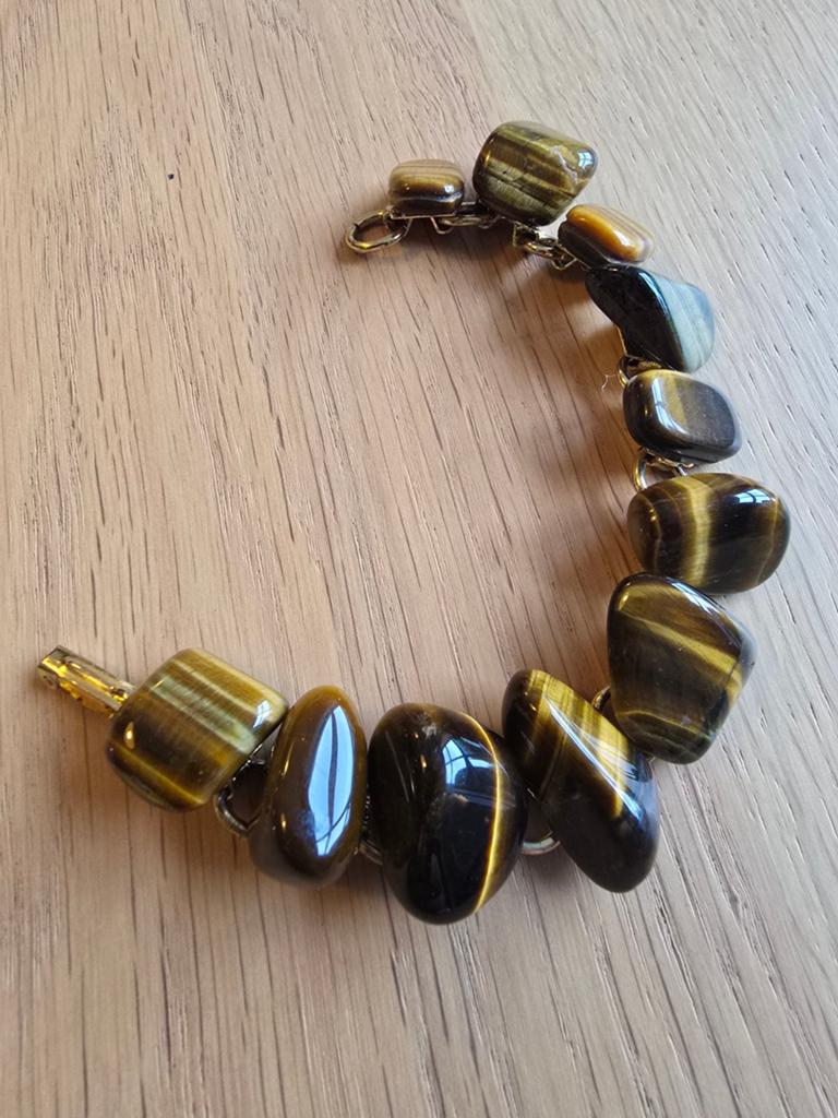 Vintage Modernistische goudkleurige tijgeroog Armband €15 !!, Ophalen of Verzenden, Zo goed als nieuw, Goud
