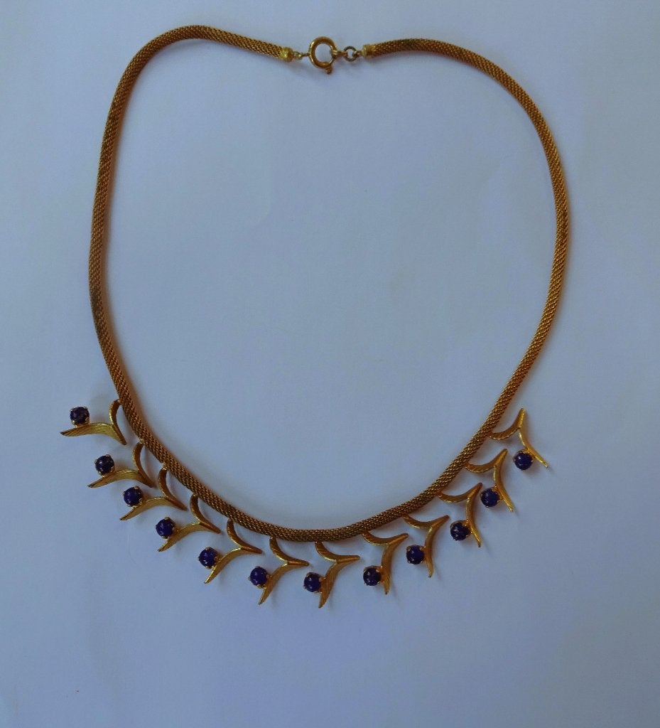 Goudkleurige slangen ketting vleugeltjes met blauw steentje, Gebruikt, Verzenden, Goud, Overige materialen