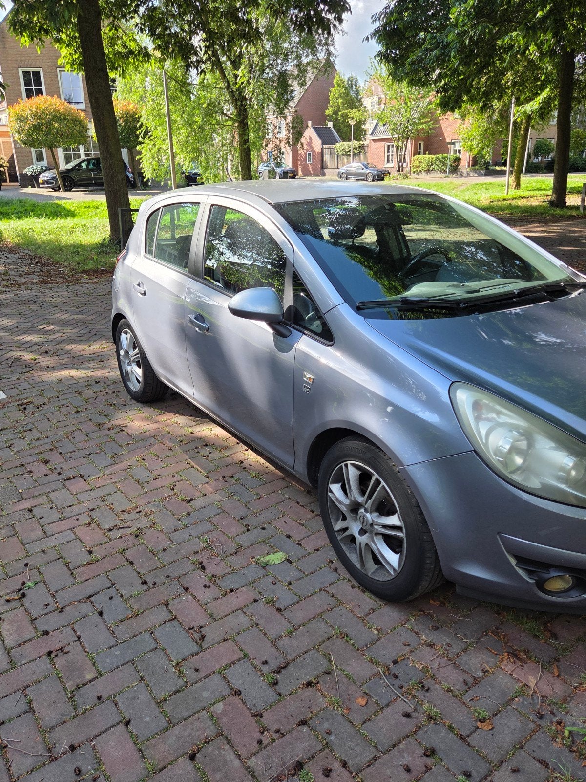 Opel Corsa 1.2 Twinport 85pk 5d 2010 Grijs, Auto's, Voorwielaandrijving, Stof, Zwart, 4 cilinders