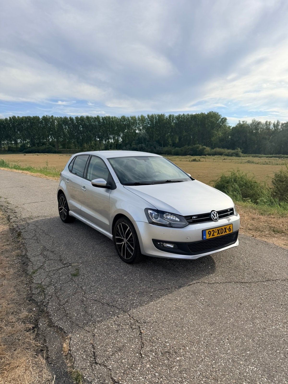 Volkswagen Polo 1.2 TSI 77KW 2012 Grijs, Auto's, Voorwielaandrijving, Stof, 40 €/maand, Zwart