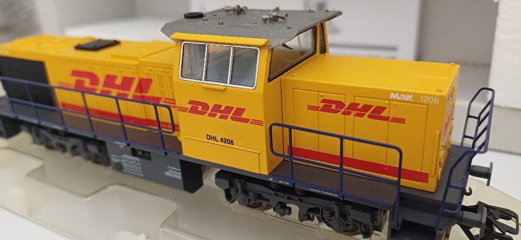 Märklin 37635.1 Diesellocomotief MaK 1206 'DHL' NS REPLICA!, Hobby en Vrije tijd, Modeltreinen | H0, Wisselstroom, Locomotief