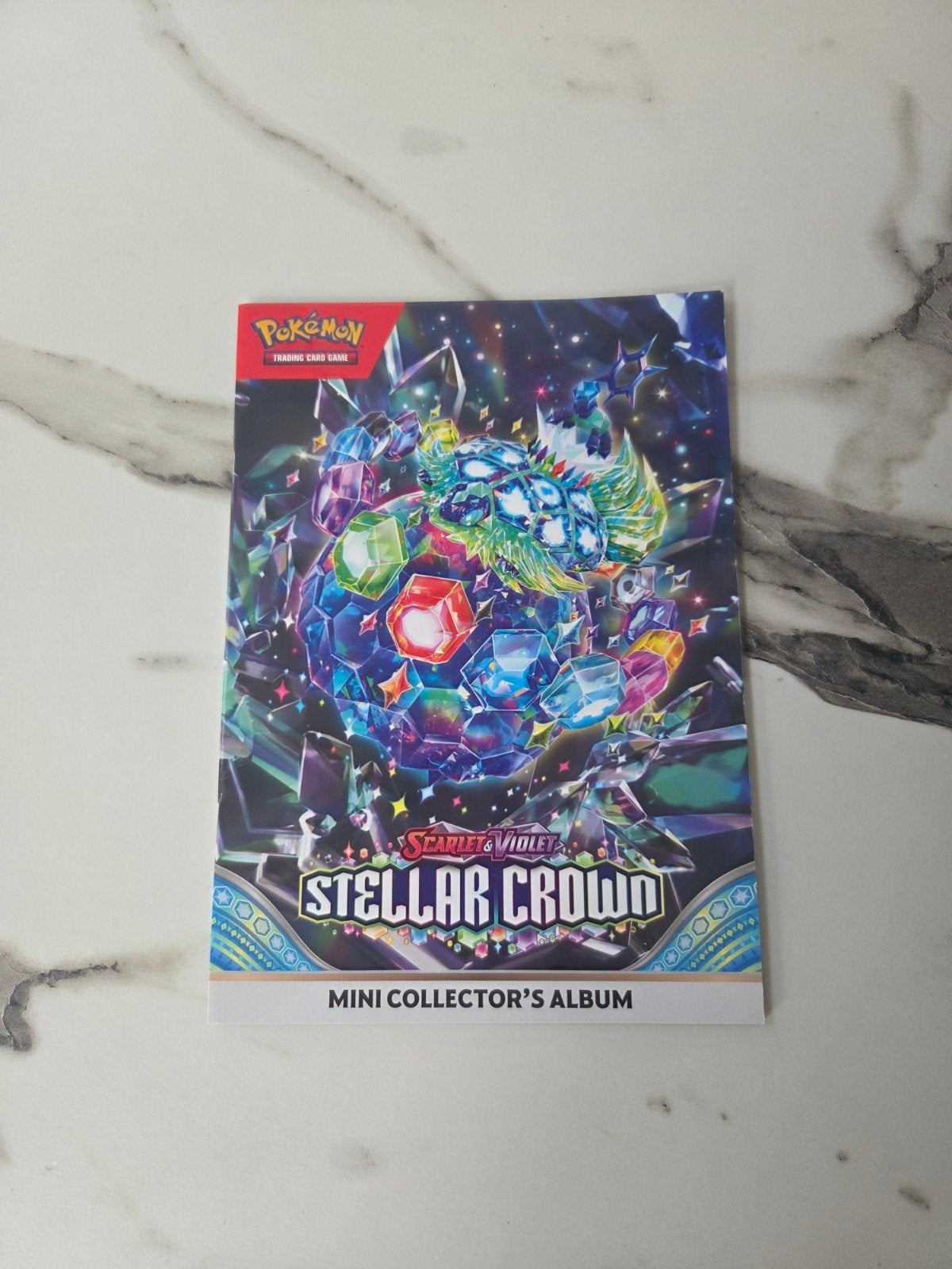 Pokémon kaarten mini collector's album Stellar Crown, Hobby en Vrije tijd, Verzamelkaartspellen | Pokémon, Ophalen of Verzenden