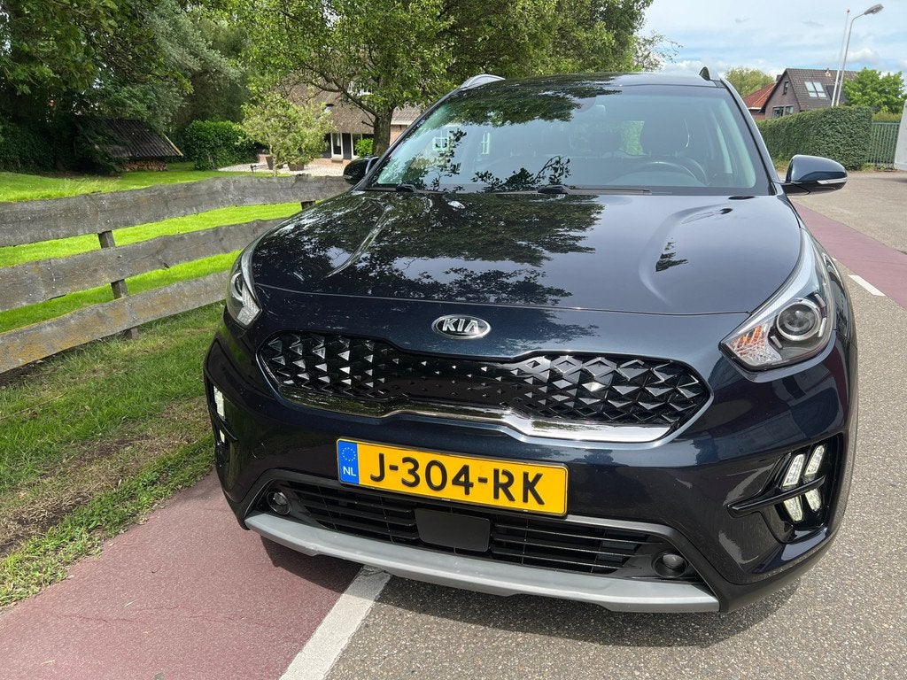 Kia Niro 1.6 GDi Hybrid DynamicLine Automaat Clima Navi, Auto's, Kia, Automatische klimaatregeling, Gebruikt, Blauw, Leder en Stof