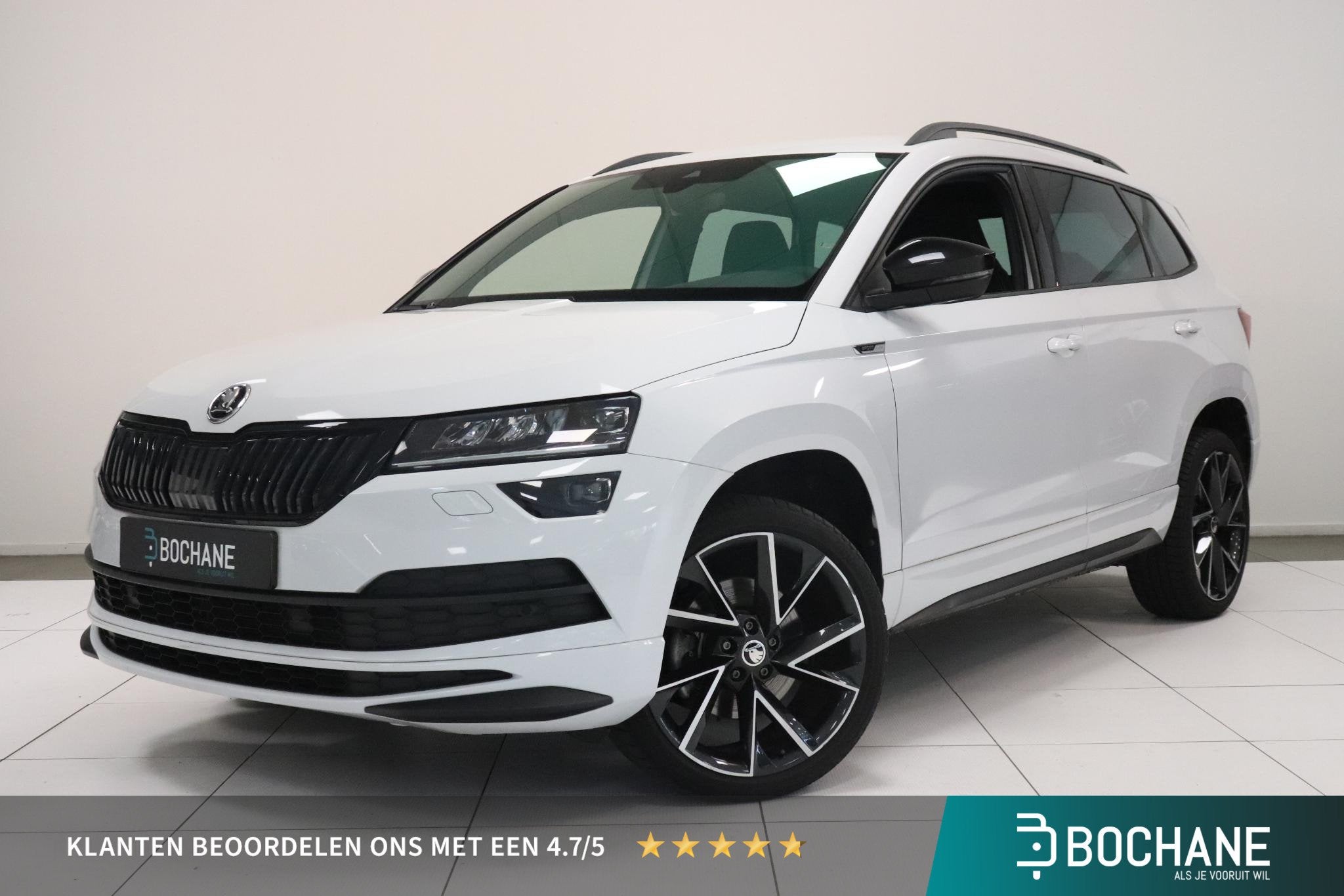 Skoda Karoq 1.5 TSI ACT Sportline Business | Camera | Adapti, Stof, 4 cilinders, Wit, Bedrijf