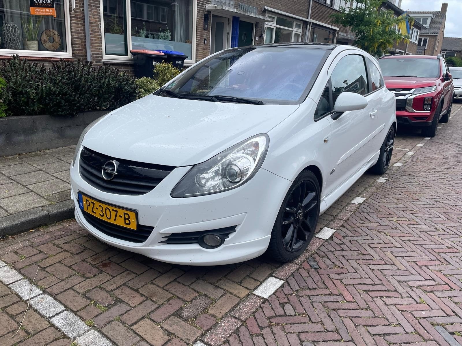 Opel Corsa 2010 Wit, Auto's, Opel, Wit, Stuurwielverwarming, 1364 cc, Particulier
