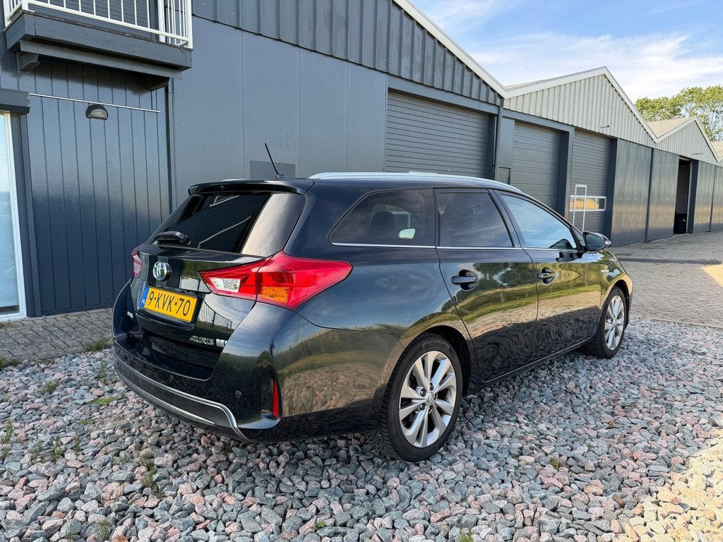 Toyota Auris Touring Sports 1.8 Hybrid Executive, Auto's, Toyota, Euro 5, Gebruikt, Automatische klimaatregeling, Leder en Stof