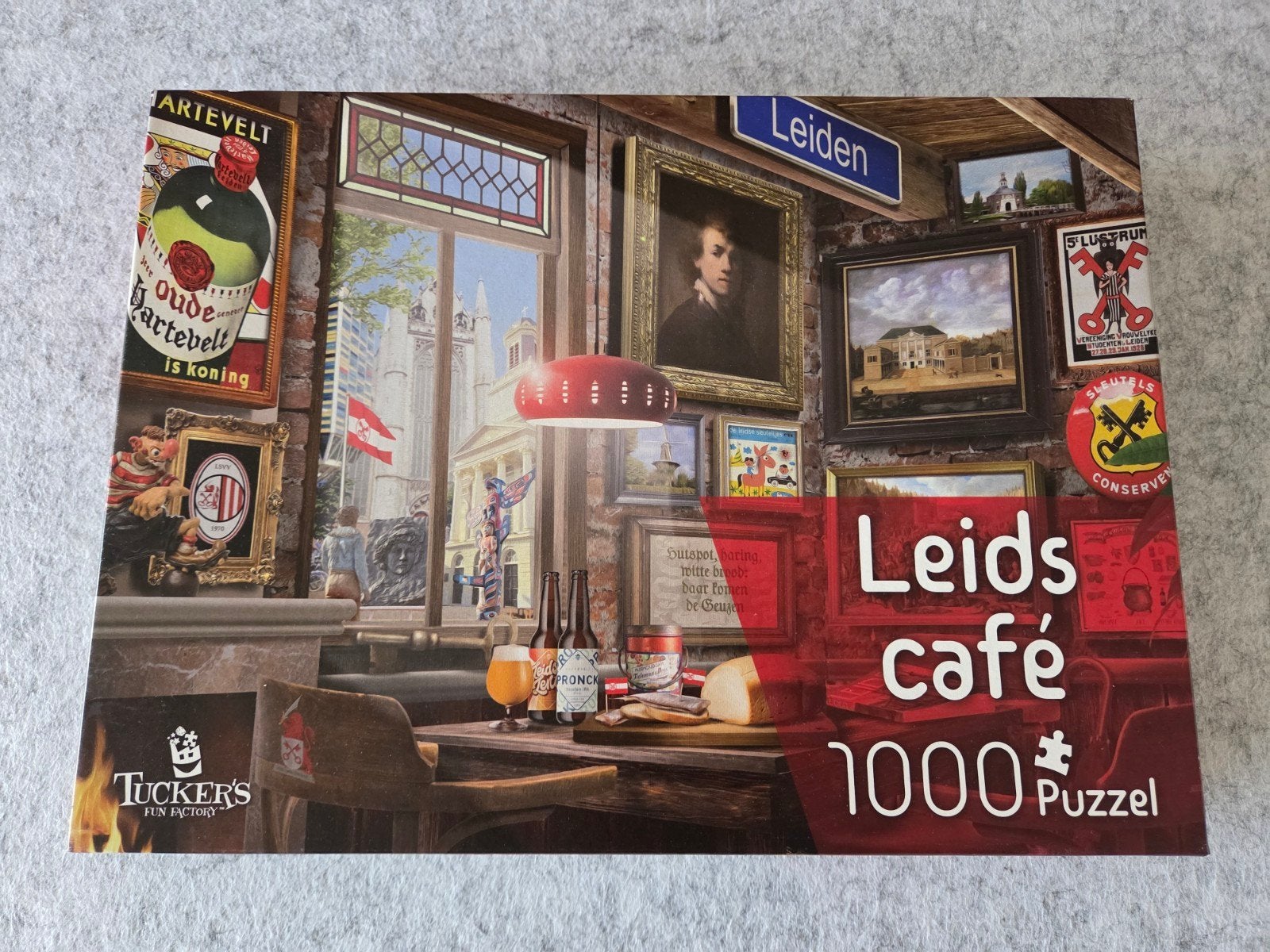 Leids Café 1000 stukjes puzzel van Tuckers, Ophalen, 500 t/m 1500 stukjes, Zo goed als nieuw, Legpuzzel
