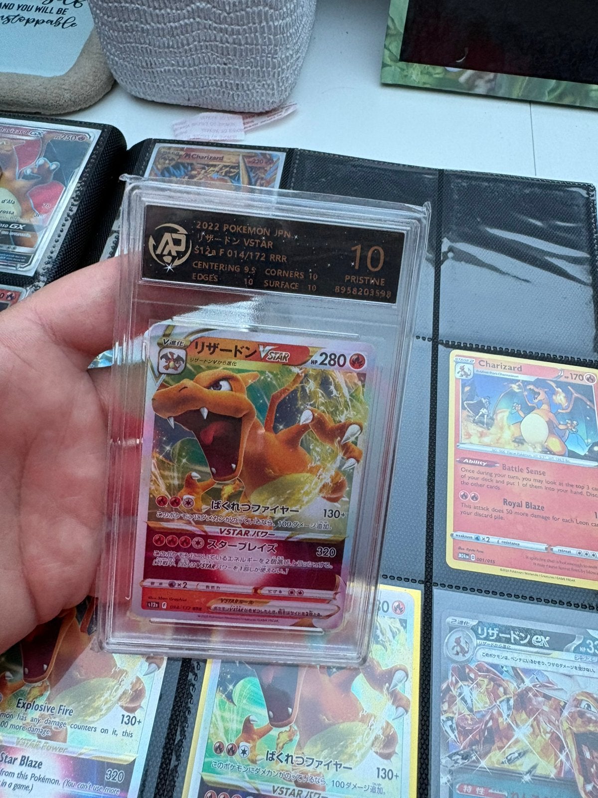 Charizard vstar pristine 10, Ophalen of Verzenden, Zo goed als nieuw, Meerdere kaarten, Foil