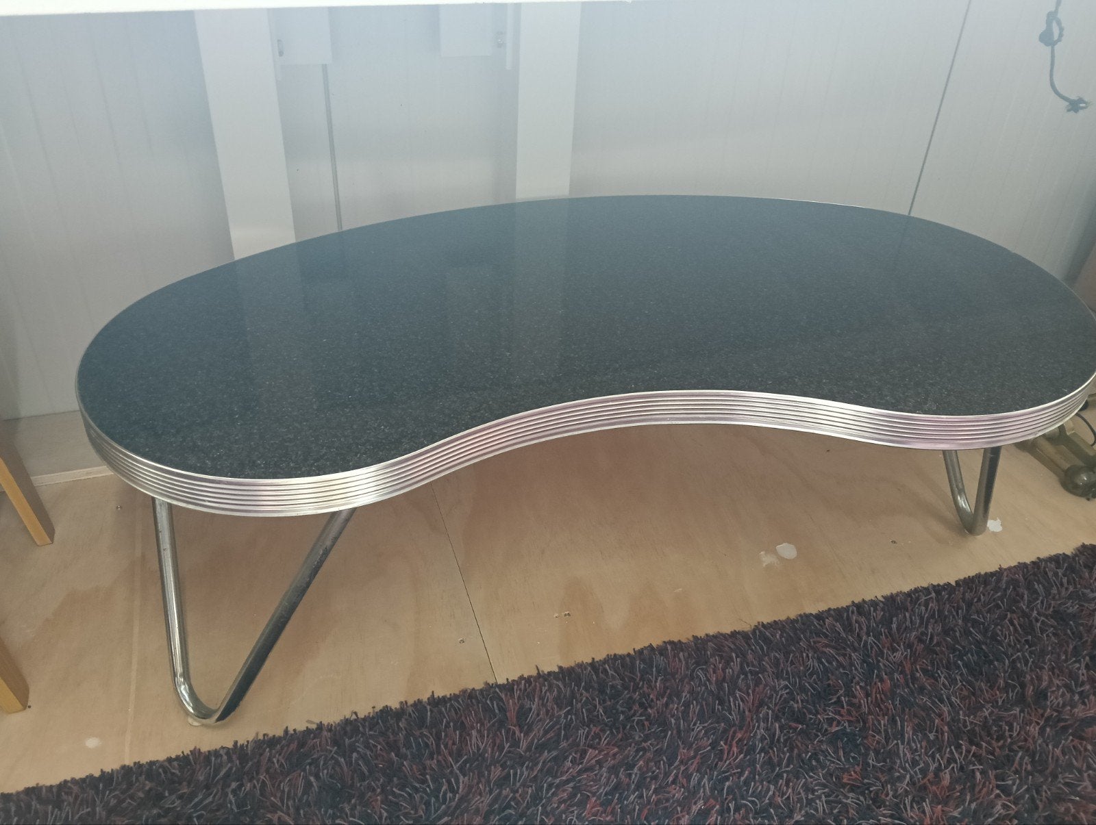 Nier salontafel met granietlook blad en chromen poten, Ophalen, Gebruikt, 100 tot 150 cm, Onbekend