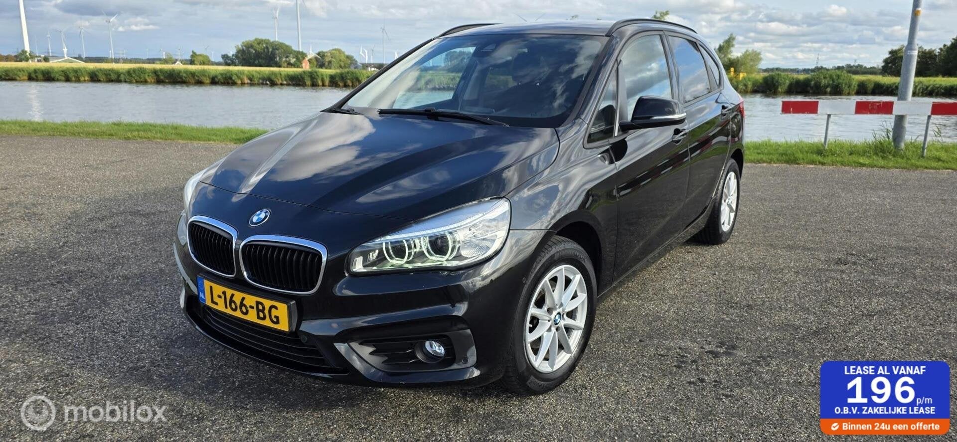 BMW 2-serie Active Tourer 216i High Executive, 97000km A, Auto's, Voorwielaandrijving, Gebruikt, Euro 6, Zwart