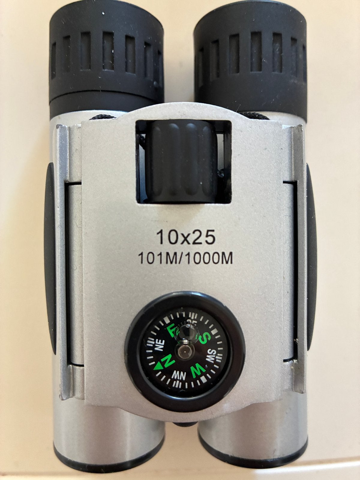 Compacte Verrekijker 10x25 met Ingebouwd Kompas NIEUW, Ophalen of Verzenden, Zo goed als nieuw, 8 tot 12x, Dakkant (recht)