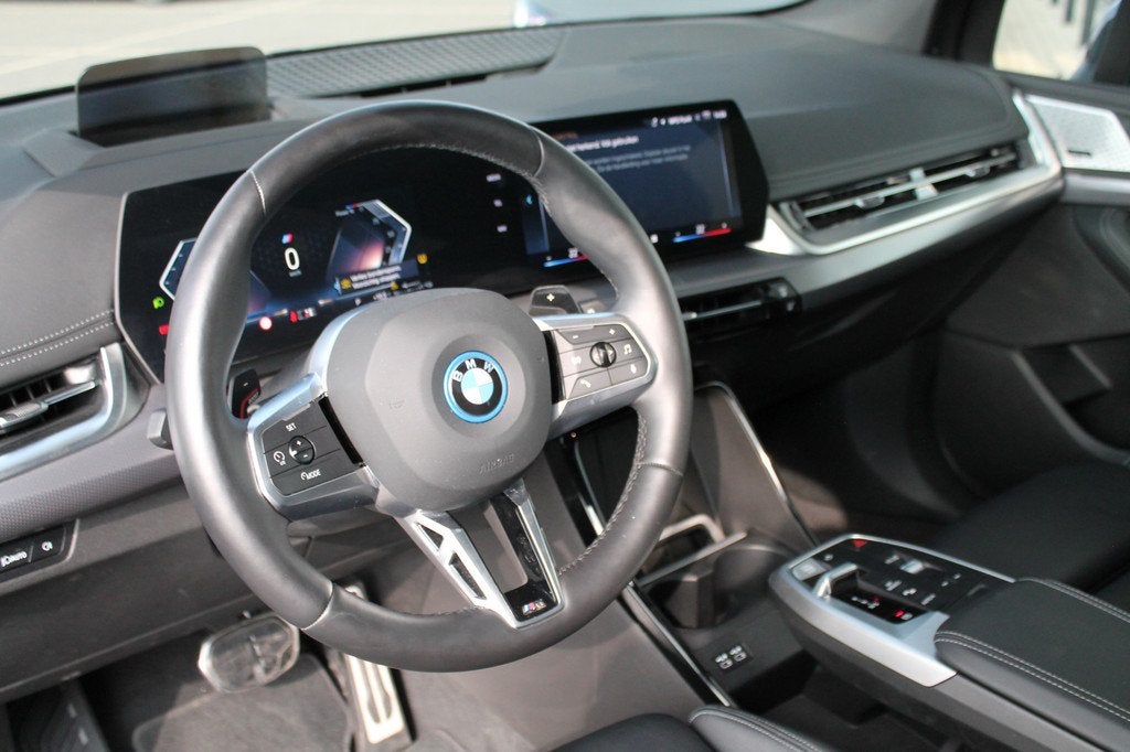BMW 2 Serie Active Tourer 225e xDrive Automaat / Panoramadak, Auto's, BMW, 1800 kg, Gebruikt, Met garantie (alle), Zwart