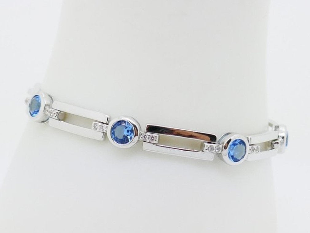 Moderne zilveren armband met topaas., Sieraden, Tassen en Uiterlijk, Armbanden, Nieuw, Ophalen of Verzenden, Met edelsteen, Zilver
