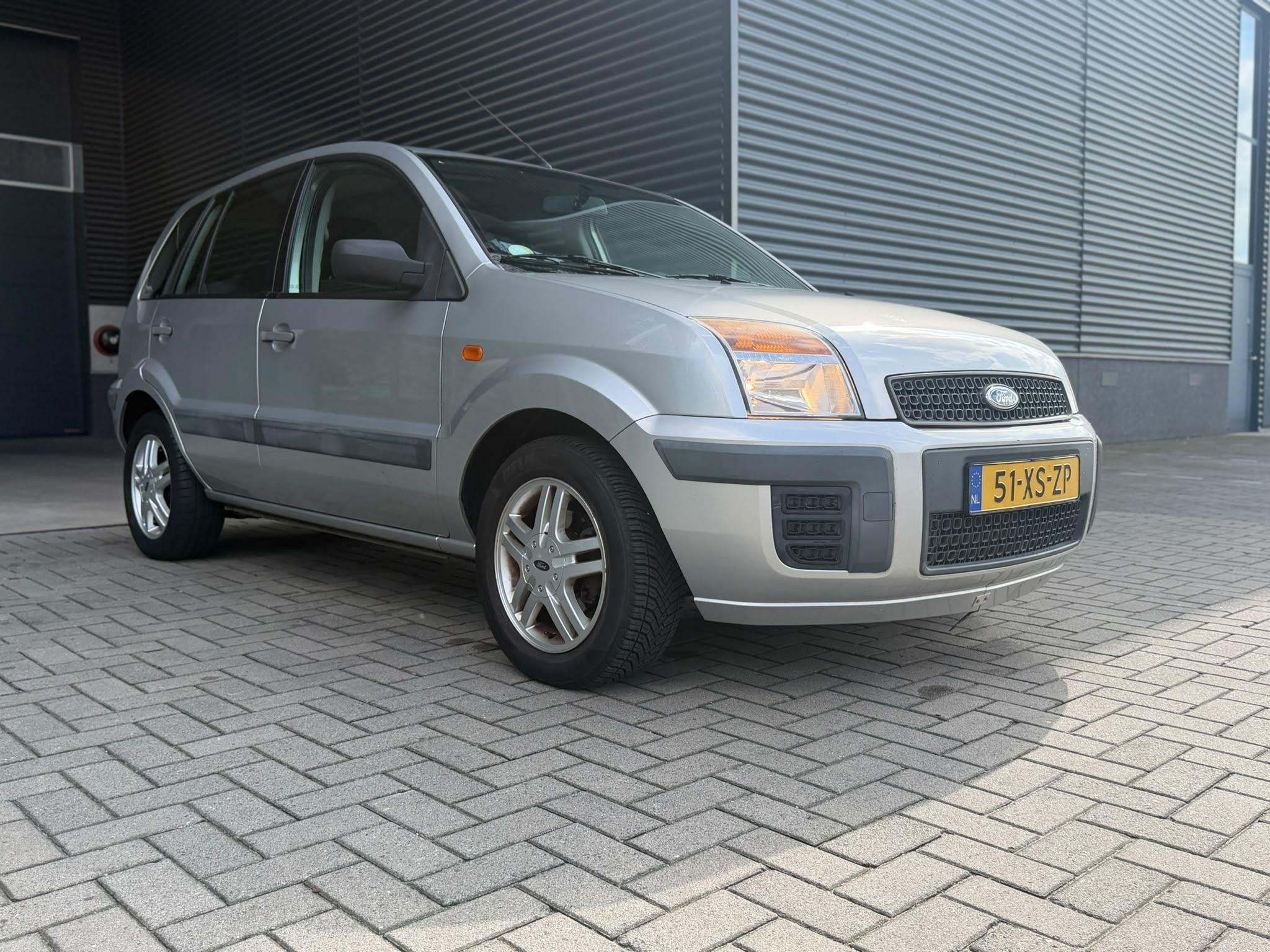 Ford Fusion 1.4 16V Champion *AIRCO*LAGE KM*ELEKTR RAMEN, Voorwielaandrijving, Gebruikt, 49 €/maand, Origineel Nederlands