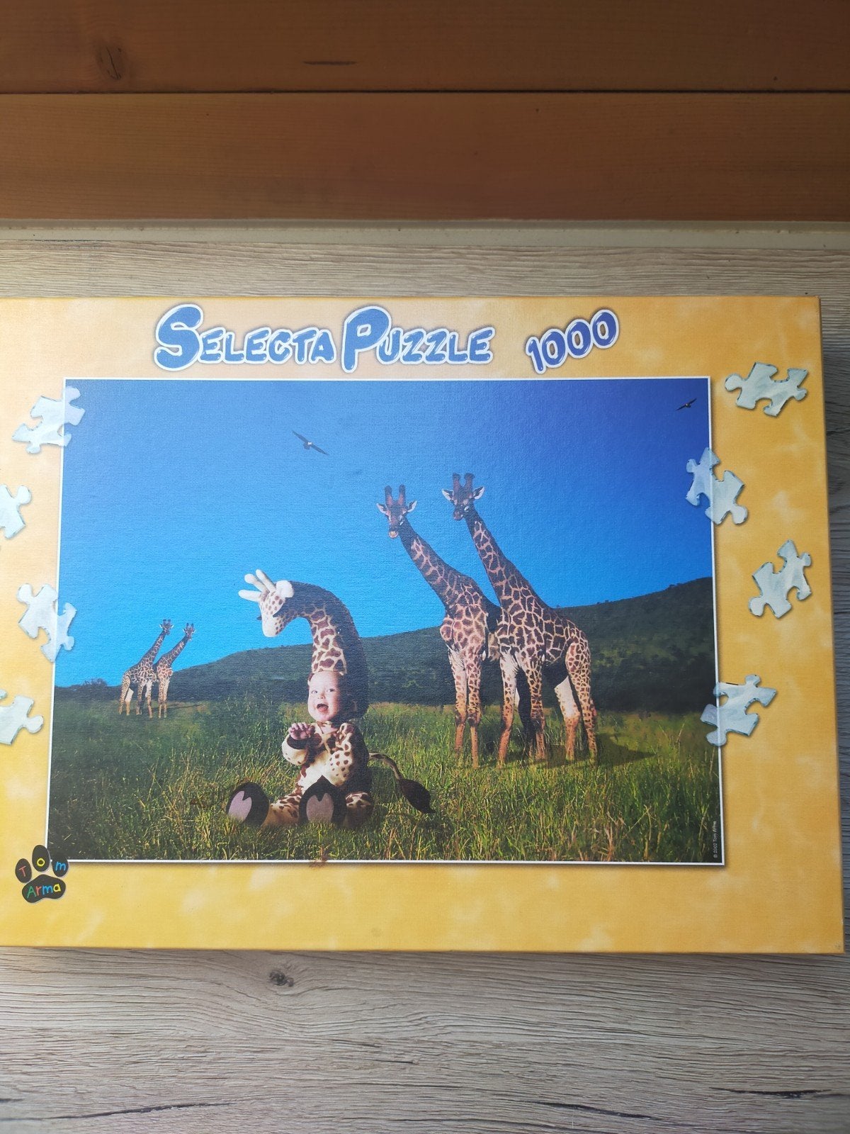 Selecta Puzzle 1000 stukjes - Baby met giraffen, Hobby en Vrije tijd, Denksport en Puzzels, Ophalen of Verzenden, 500 t/m 1500 stukjes
